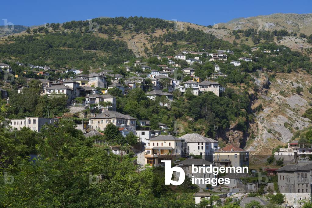 Gjirokastra or Gjirokaster, Albania.  Typical traditional property on edge of old town. Gjirokastra is a UNESCO World Heritage Site. (photo)