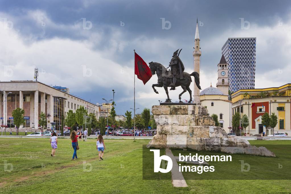 Skanderbeg Square with monument to Skanderbeg,, Albanian national flag, Et'hem Bey mosque in background, Tirana, Albania (photo)