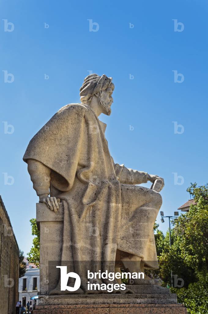 Cordoba, Cordoba Province, Andalusia, Spain.  Statue of Averroes, Muslim polymath born in Cordoba 1126, died Marrakech, Morocco, 1198. The Historic Centre of Cordoba is a UNESCO World Heritage Site.
