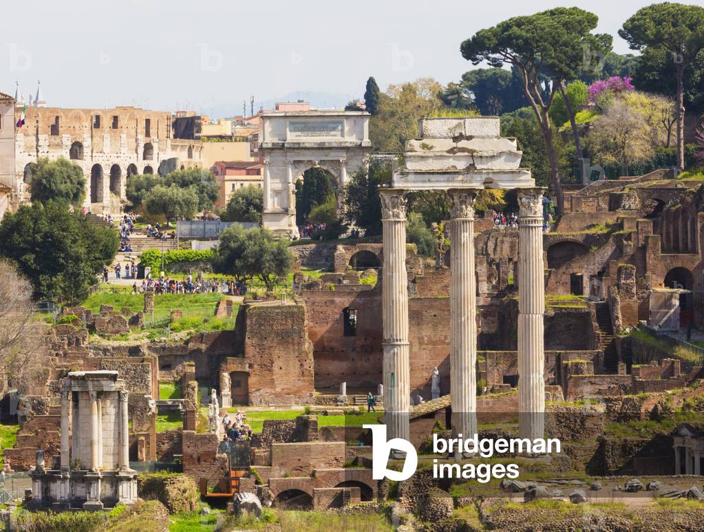 The Roman Forum, the three columns of the Temple of Castor and Pollux and the Arch of Titus in the background, Rome, Italy (photo)