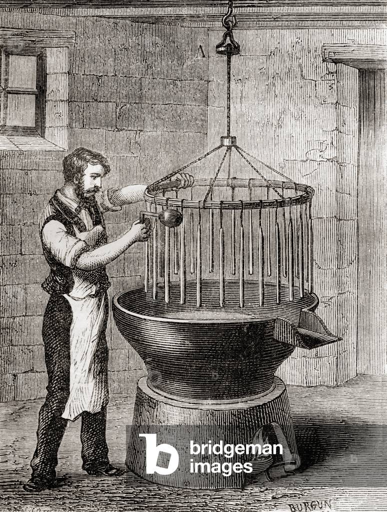 A chandler making candles in the 19th century, from 'Les Merveilles de la Science', published c.1870 (engraving)