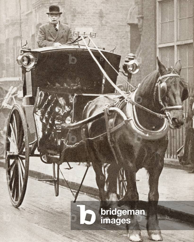 A Hansom Cab in London, England in 1910.  From The Story of 25 Eventful Years in Pictures, published 1935.