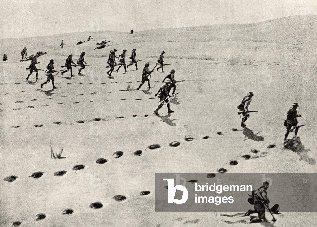 Union troops plodding forward under fire, during the desert phase of the South-West African campaign, from 'The Great War: A History', volume III, 1916 (litho)