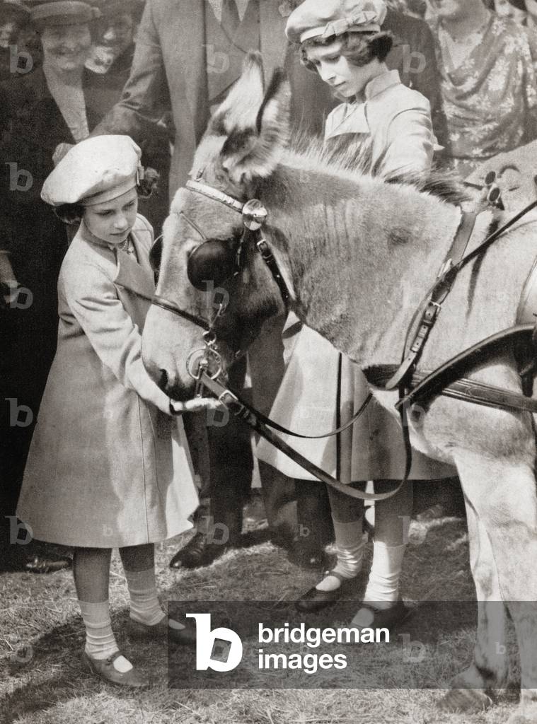 Princess Margaret, left, and Princess Elizabeth, future Queen Elizabeth II, right, at the Royal Agricultural Show in 1939 (b/w photo)