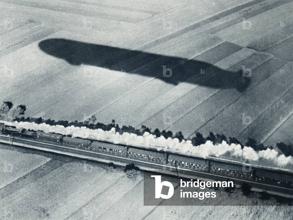 Shadow of the fast Zeppelin air ship Schwaben keeping pace with an express train, from 'The Illustrated War News', published in 1915 (litho)