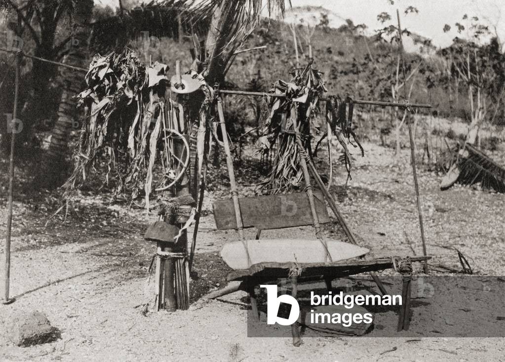 A death chair from Koita, Papua New Guinea, Oceania.  The body of a dead man was placed in a sitting position on this prior to burial and his two nearest relatives sat on either side of it, then after an hour's drum beating and dirge singing the dead man's chief possessions were broken up and placed by the chair.  From Customs of The World, published c.1913.