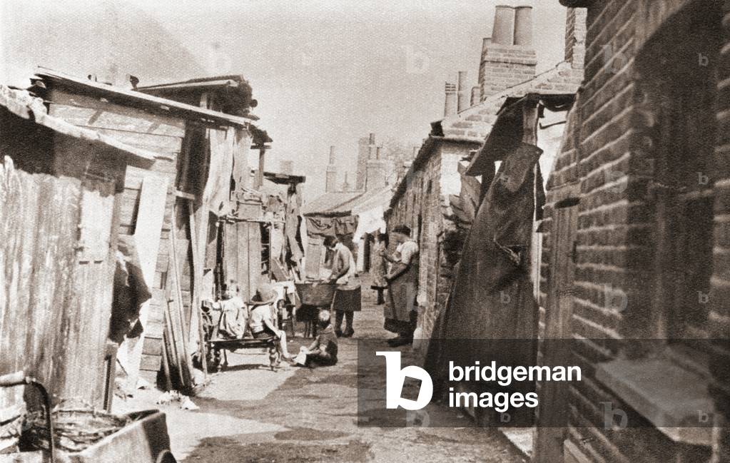 Poor tenements in England during the 1930's.  From The Story of Seventy Momentous Years, published by Odhams Press 1937.