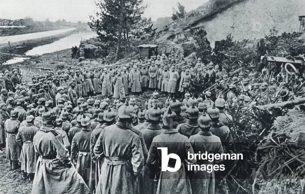 German soldiers attending a Divine Service on the banks of the Aisne Canal during World War I, from 'The Illustrated War News', published in 1915 (litho)