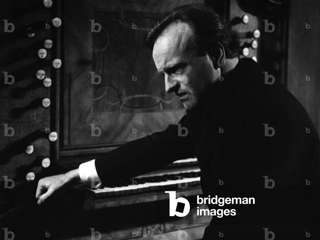 Karl Richter sitting at the organ. German organist and conductor, 15 October 1926 - 15 February 1981.