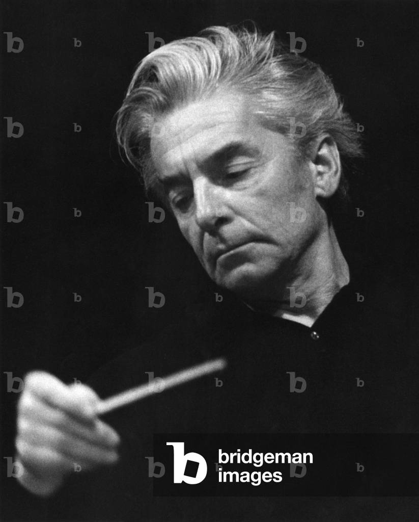 Herbert von Karajan conducting with baton. Austrian conductor, 5 April 1908 - 16 July 1989.