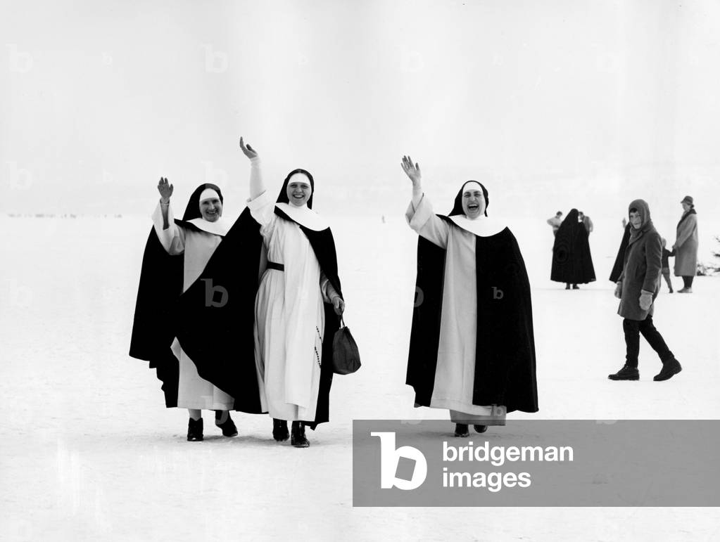 Nuns waving on the ice at Lake Constance in 1963