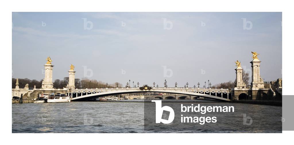 The Alexandre III Bridge in Paris. Tsar Alexander III of Russia (1845-1894) laid the first stone of the bridge in 1886, which was to be completed for the 1900 World Expo. One of the most beautiful bridges in Paris has a single-flight metal structure. Photography 10/03/06.