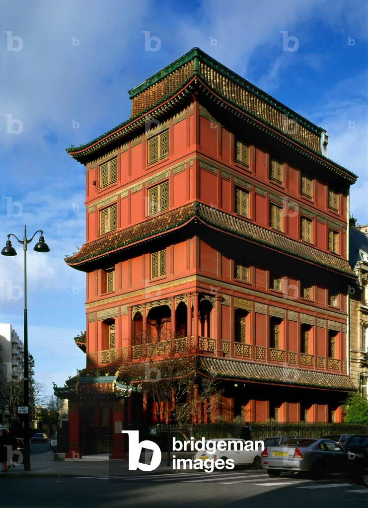 La Pagode, Place du Perou, Paris 8th arrondissement. A red pagoda in the heart of Paris: it is the seat of C.T. Loo et compagnie, the oldest Chinese antique dealer in Paris. This famous Chinese pagoda of Ching Tsai Loo, located near Parc Monceau at the corner of Rue de Courcelles and Rue Rembrandt (currently Place du Perou), was built between 1926 and 1928 with the collaboration of a French architect, Fernand Bloch, on the site of a former Louis Philippe mansion.