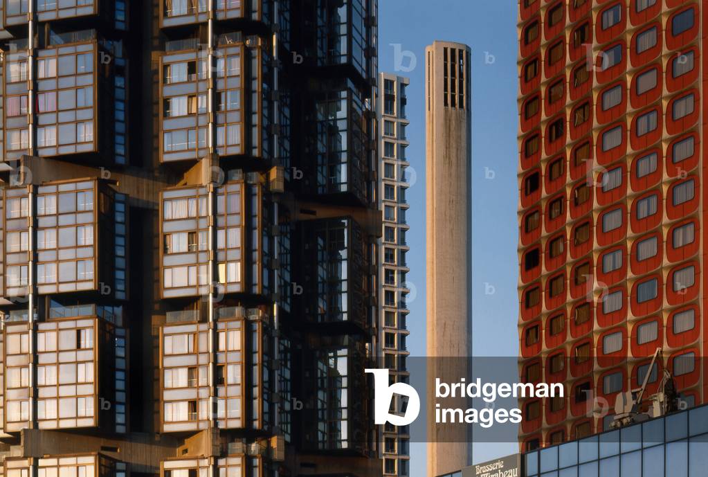 Detail of the Totem Tower, the fireplace of the district heating and the facade of the ex hotel Nikko. Front de Seine Paris 15th arrondissement.