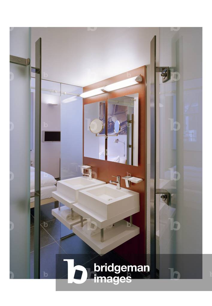 The hotel Kruisheren in Maastricht, Netherlands (Netherlands) realized by Satijn more architects and Vos interieur Mapertuus in 2005. Photography 15/03/06. In the heart of the historic centre of Maastricht, the 15th century Kruisherenklooster was inaugurated as a hotel in May 2005. In a very contemporary and innovative style and furniture by the Dutch interior architect Henk Vos (Maupertuus) and the famous lighting architect Ingo Maurer.