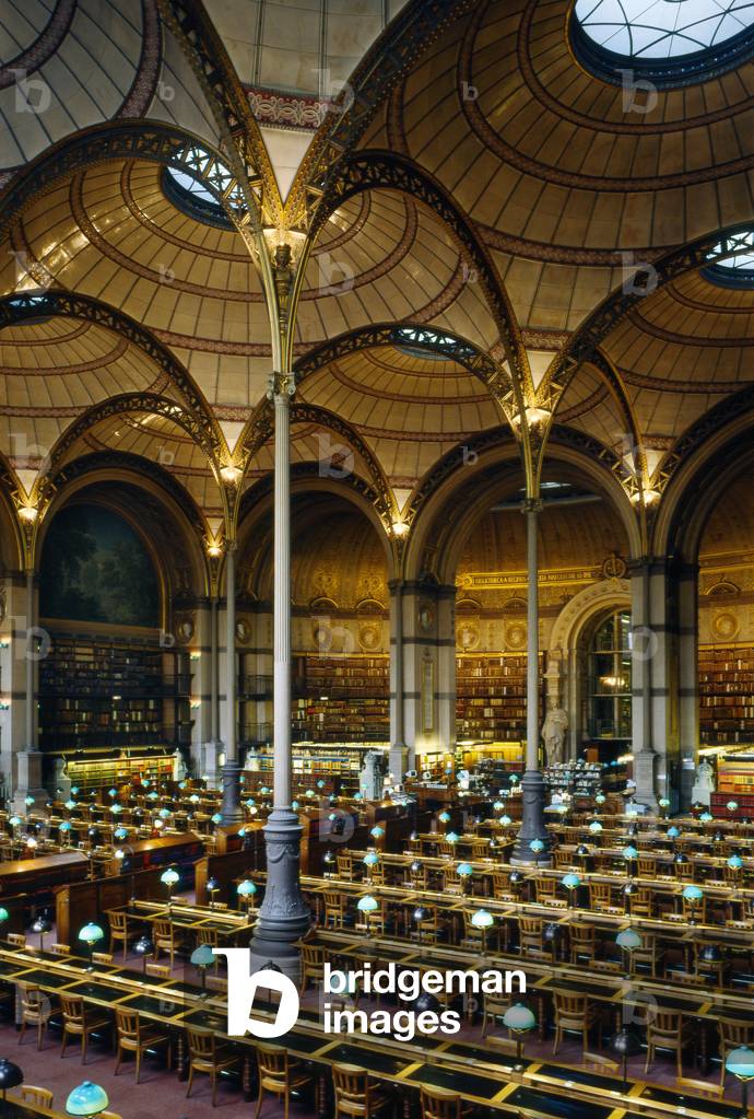 Salle des Imprimes de la bibliotheque Richelieu, Bibliotheque nationale, Palais Mazarin, 58 rue de Richelieu, Paris 2nd arrondissement. It was Napoleon III who entrusted Henri Labrouste with the reconstruction of the imperiale library, which the increase in collections made indispensable... We no longer knew where to put the books From 43,000 books in 1688, we had gone up to 800,000 books in 1851. Since 1996, the national bibliotheque de rue Richelieu has merged with the Bibliotheque nationale de France-Tolbiac. Construction between 1859 and 1867