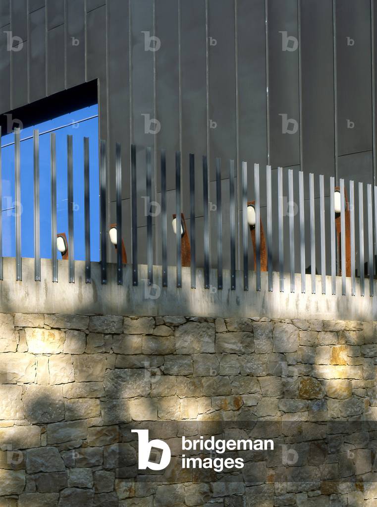 Stone wall, zinc facade.