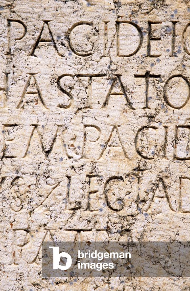 Detail of an inscription at the Roman temple complex (photo)