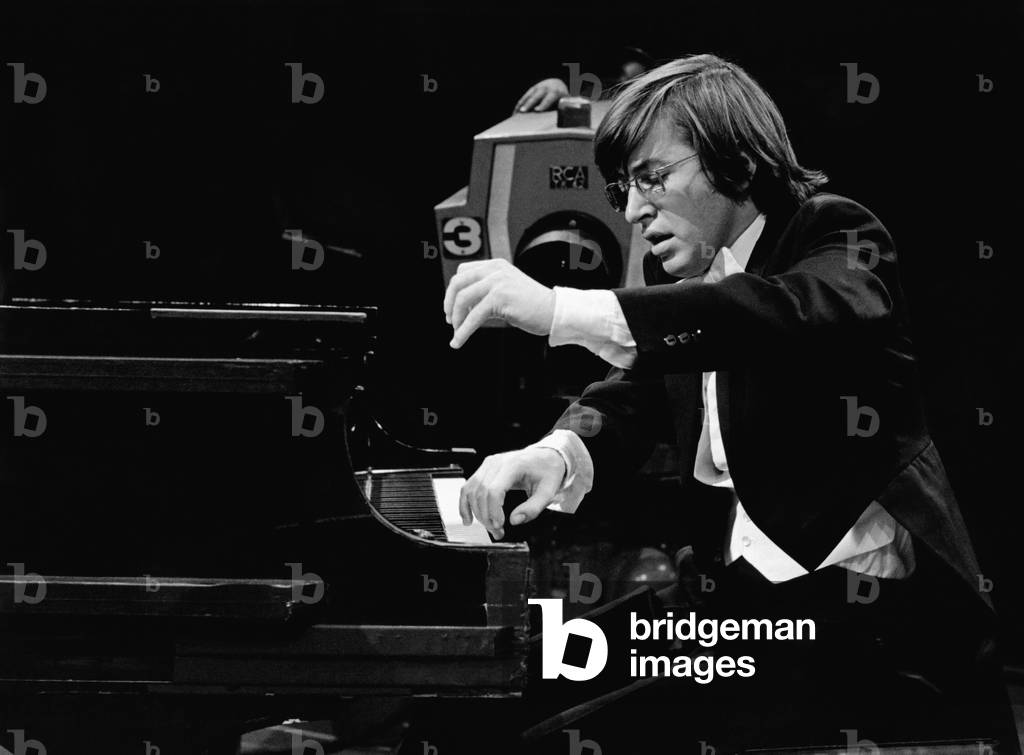 Henri Brassard playing piano