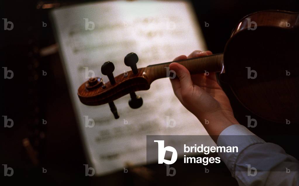 Violin being played with musical score