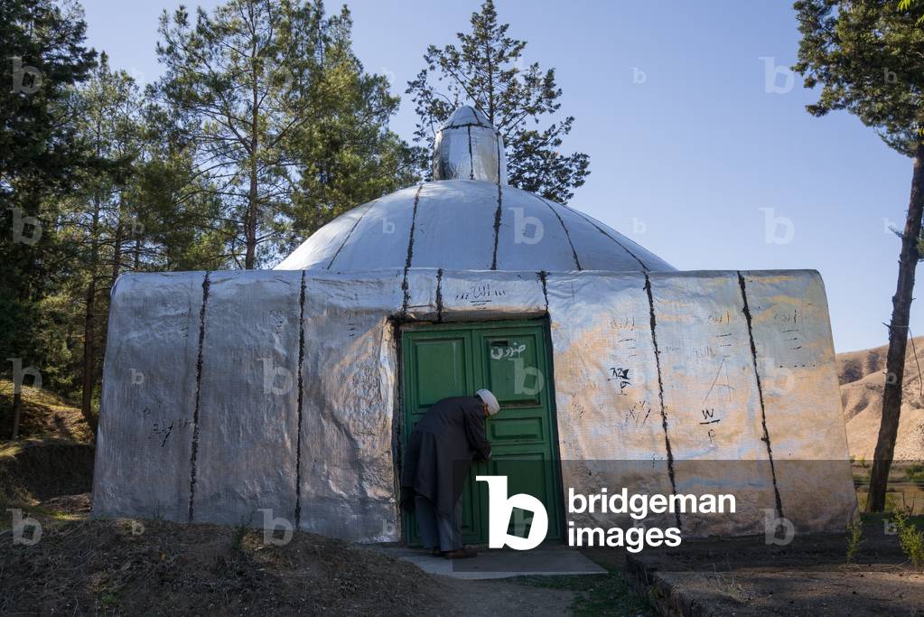 Iranian Shiite Iman Entering in a Shrine, Golestan Province, Karim Ishan, Iran (photo)