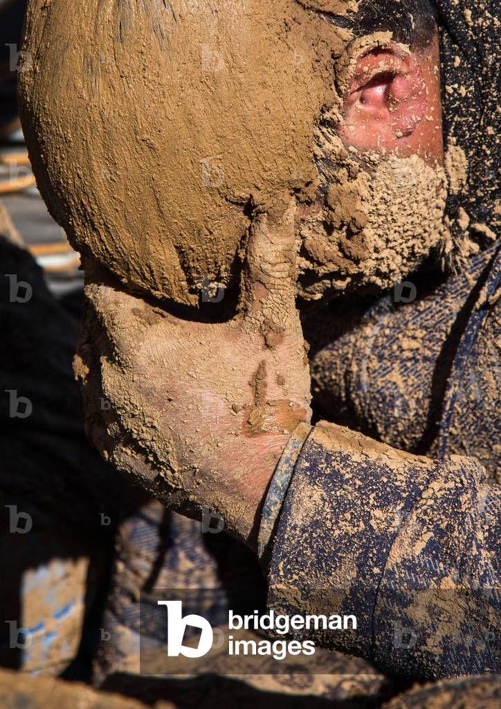 Iranian Shiite Muslim Man Covered in Mud Crying during Ashura Day, Kurdistan Province, Bijar, Iran (photo)