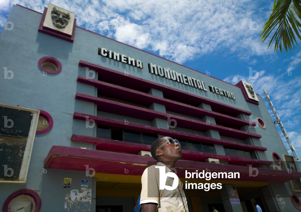 Young Fashionable Man in front of Benguela Art Deco Cinema Theater, Angola, Africa (photo)
