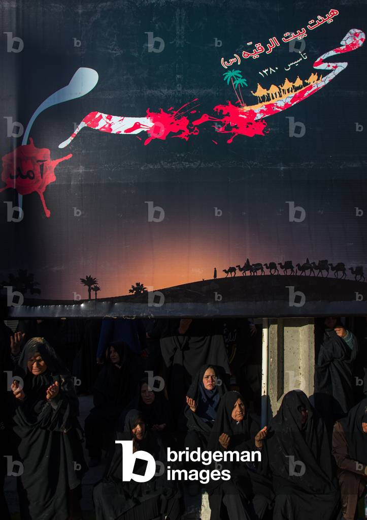Iranian Shiite Muslims Women Praying with Hands Raised during Ashura Celebration, Kurdistan Province, Bijar, Iran (photo)