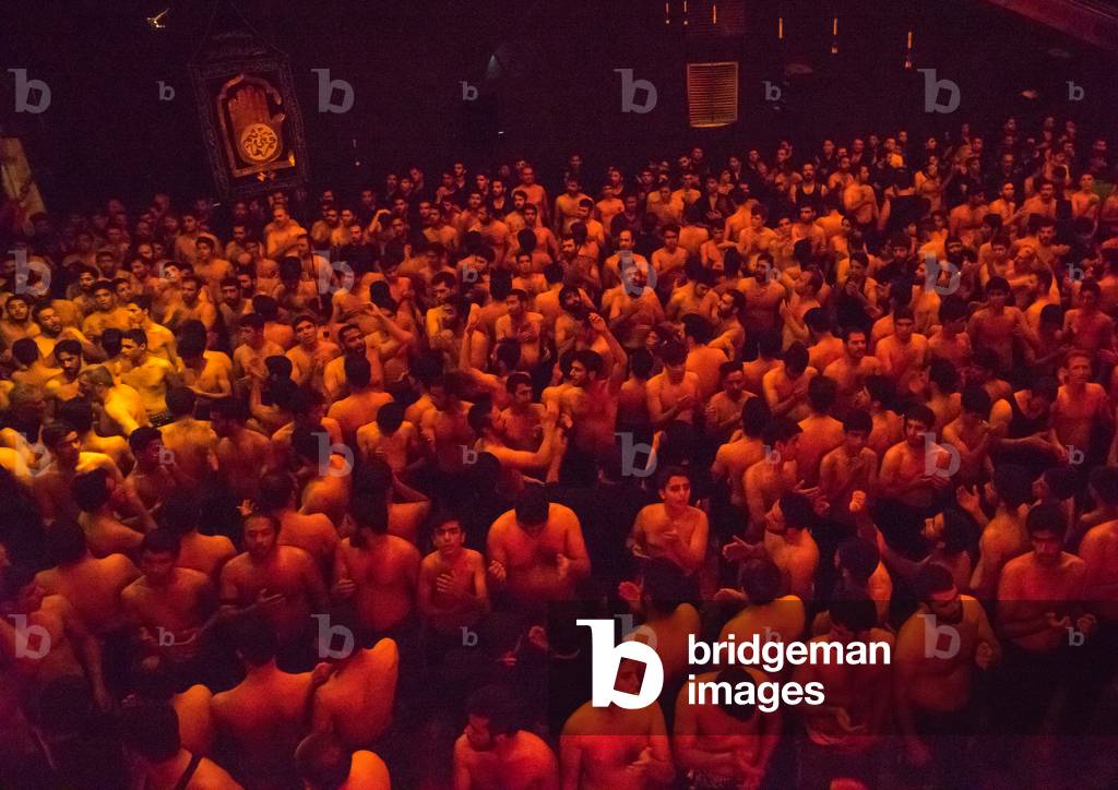 Iranian Shiite Muslim Mourners From the Mad of Hussein Community Chanting and Self-flagellating during Muharram, Isfahan Province, Kashan, Iran (photo)