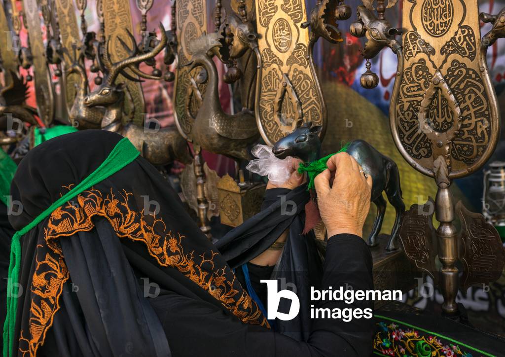 Iranian Shiite Women Putting Green Ribbons on an Alam to Make Wi (photo)