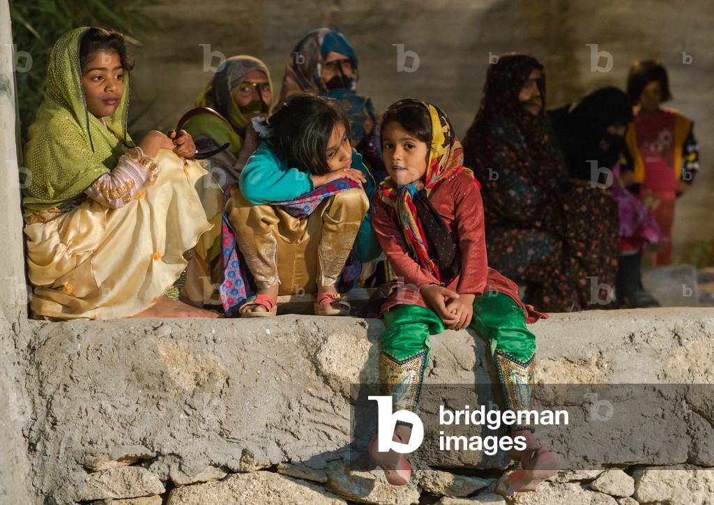 Group of girls and women with embroidered traditional trousers, Qeshm Island, Salakh, Iran (photo)