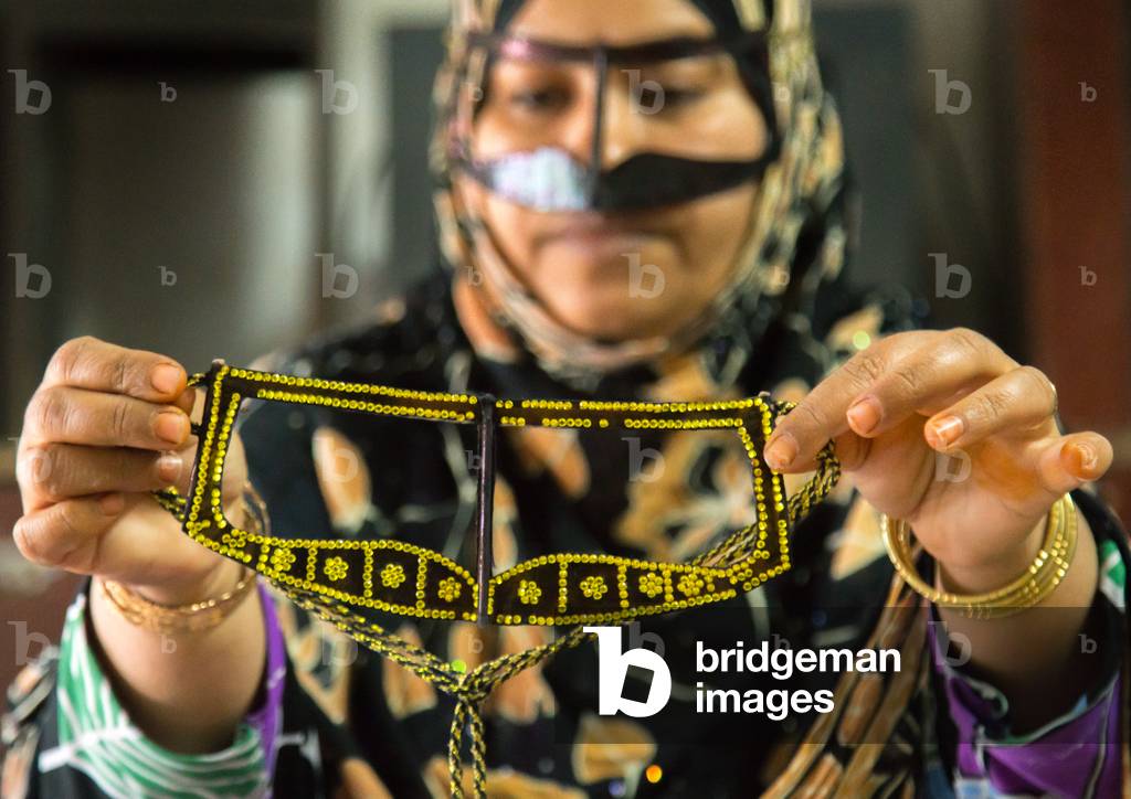 A Bandari Woman Wearing A Traditional Mask Called The Burqa With A Moustache Shape, Qeshm Island, Salakh, Iran, 2015 (photo)
