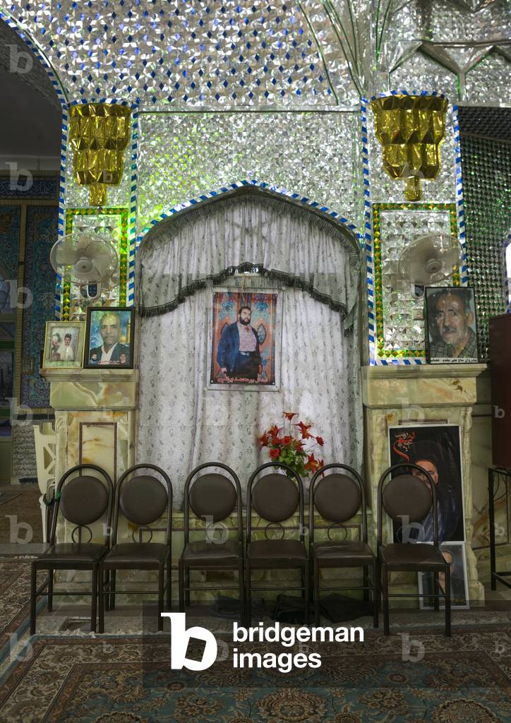 Martyrs portraits from the Iran Iraq War inside the shrine of Hasan Ibn Musa Ibn Ibn Jafar, Isfahan province, Kashan, Iran (photo)