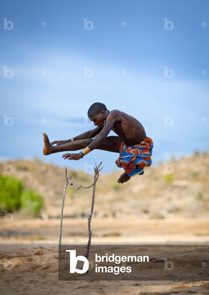 Mukubal Kid Doing High Jumping, Virie Area, Angola, Africa (photo)