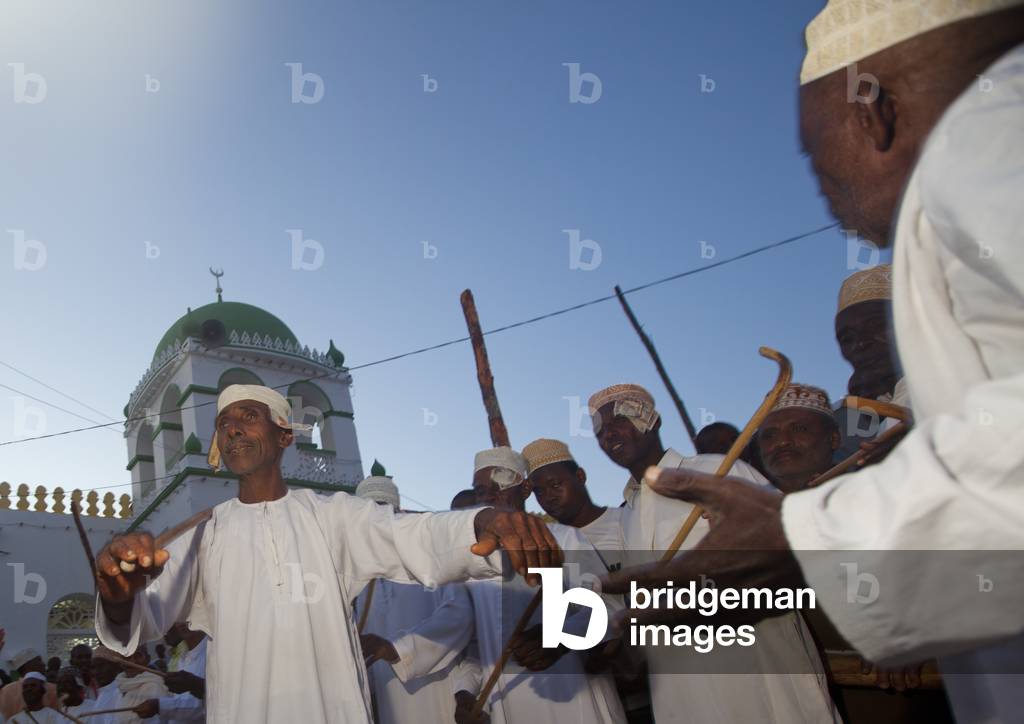 Men dancing goma stick dance at maulidi festival, Lamu, Kenya, Africa (photo)