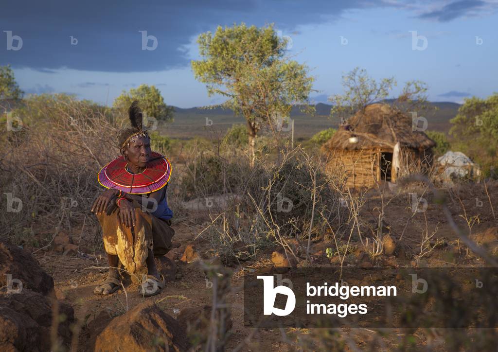 A pokot woman wears large necklaces made from the stems of sedge grass, Baringo county, Baringo, Kenya, Africa (photo)