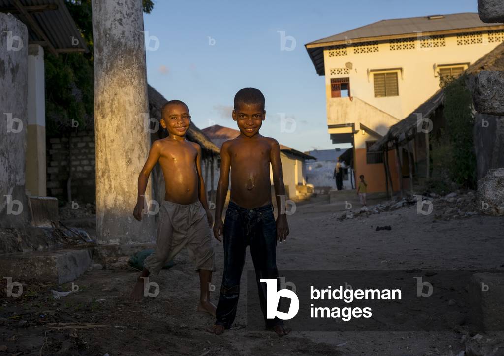 Children having a shower in the street, Lamu county, Matondoni, Kenya, Africa (photo)