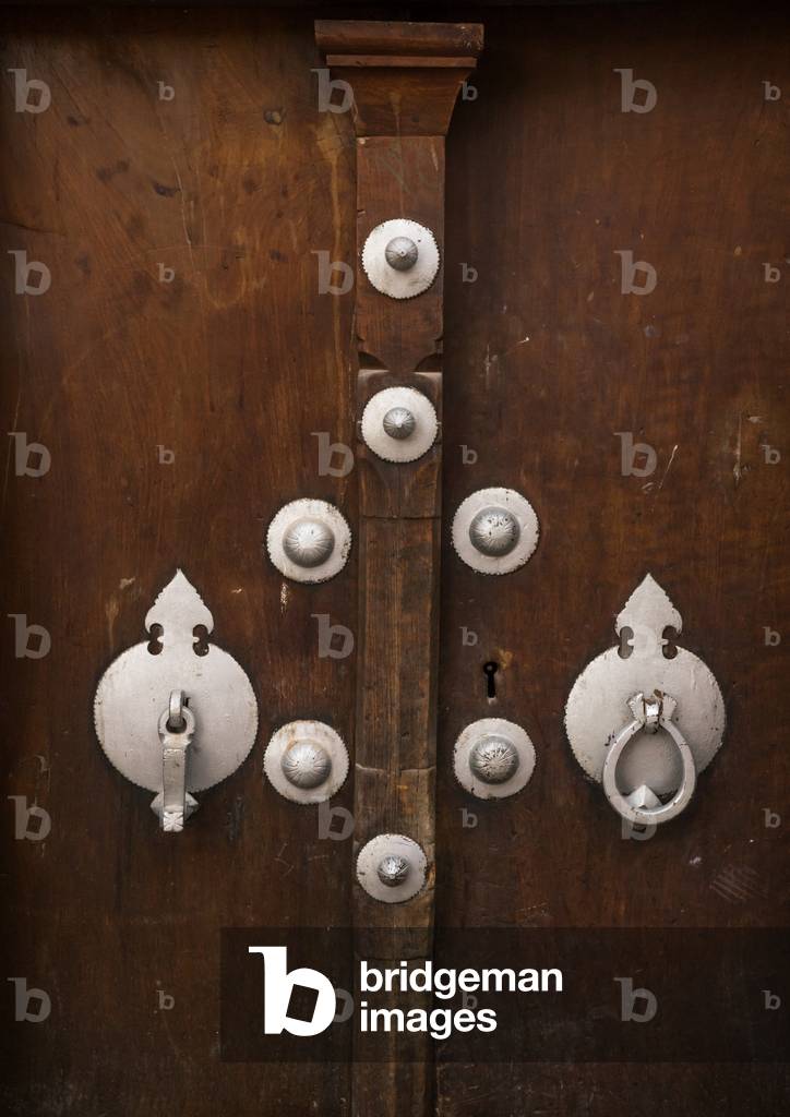 Ancient Female and Male Doorknockers on a Wooden Door, Yazd Province, Yazd, Iran (photo)