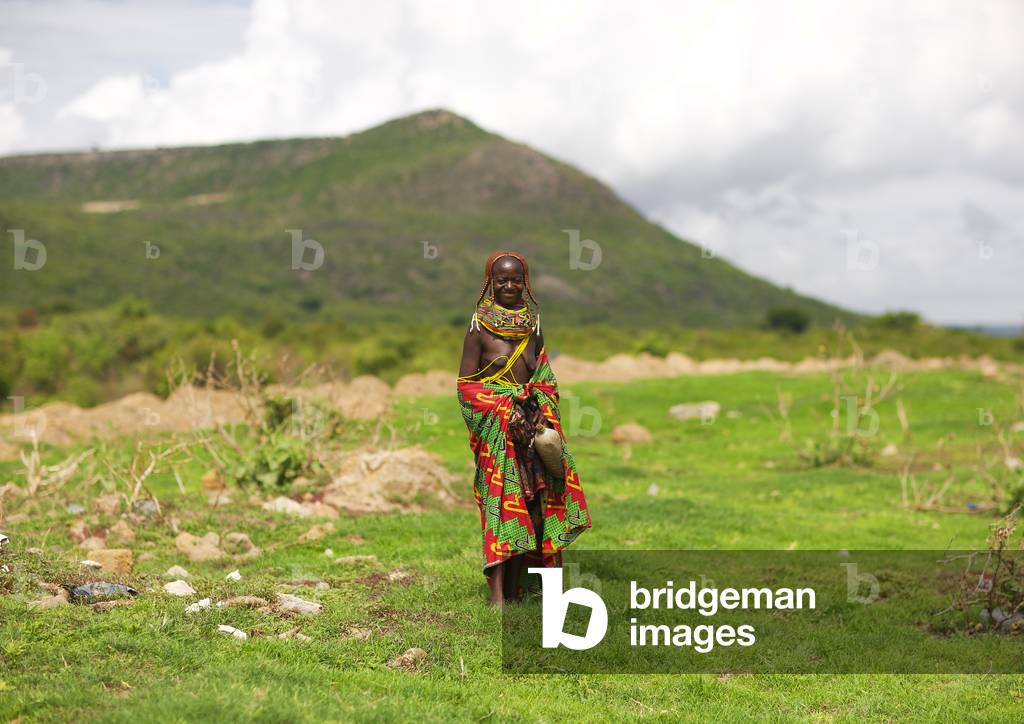 Mwila Woman with Special Hairstyle Walking in the Bush, Chibia Area, Angola, Africa (photo)