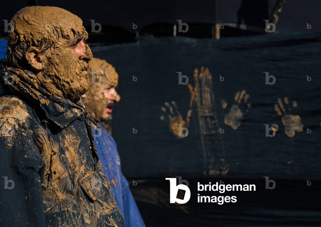 Iranian Shiite Muslim Men Covered in Mud during Ashura Day, Kurdistan Province, Bijar, Iran (photo)