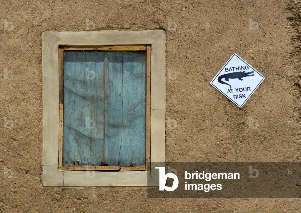 Crocodile Warning Sign on a House, Sai island, Nubia, Sudan (photo)
