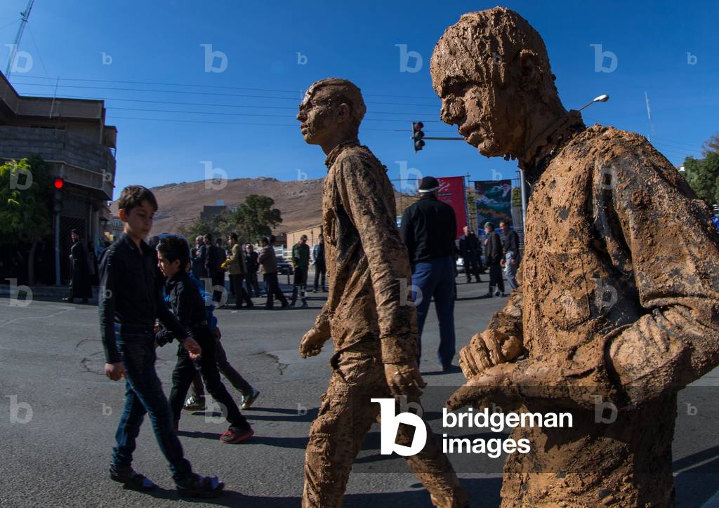 Iranian Shiite Muslim Men Covered in Mud during Ashura Day, Kurdistan Province, Bijar, Iran (photo)
