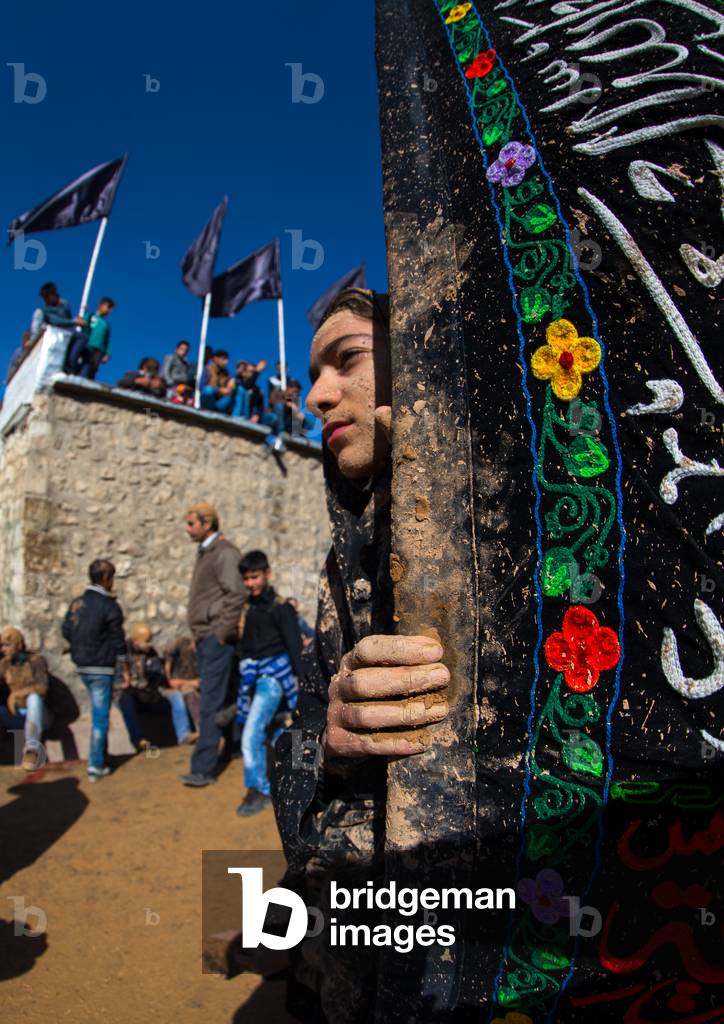 Iranian Shiite Muslim Girl Covered in Mud during Ashura, Kurdistan Province, Bijar, Iran (photo)