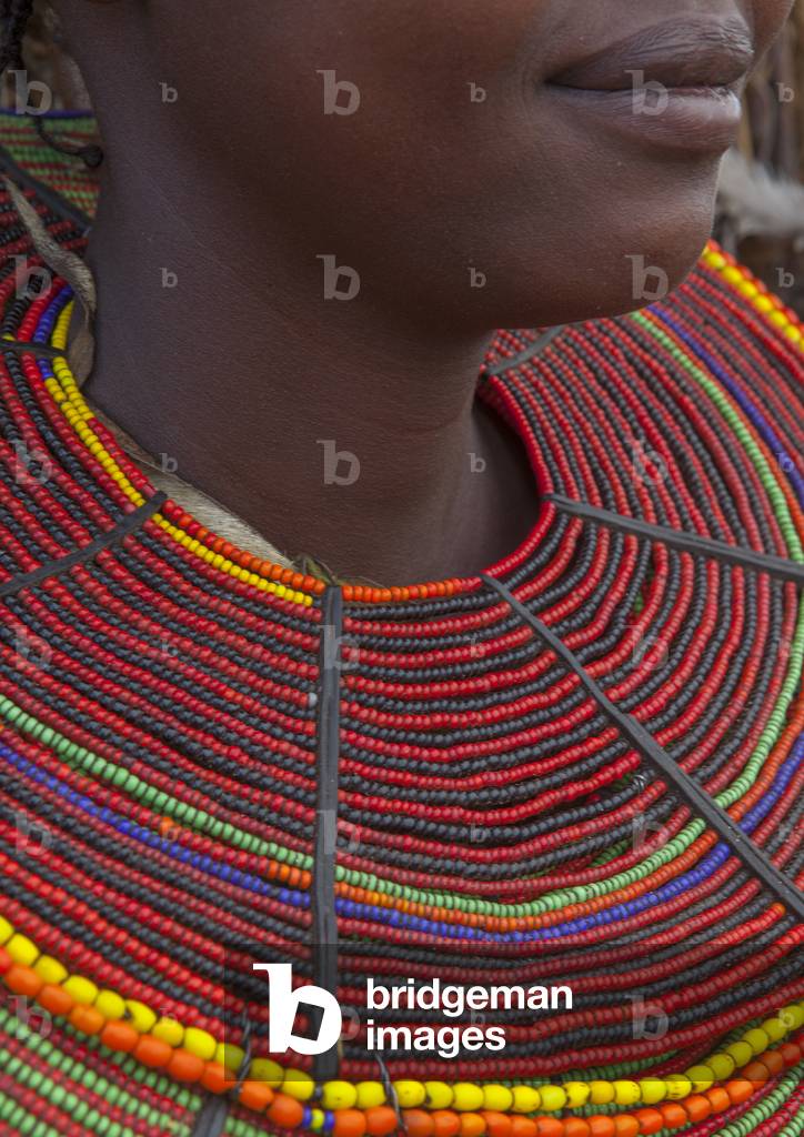 A pokot woman wears large necklaces made from the stems of sedge grass, Baringo county, Baringo, Kenya, Africa (photo)