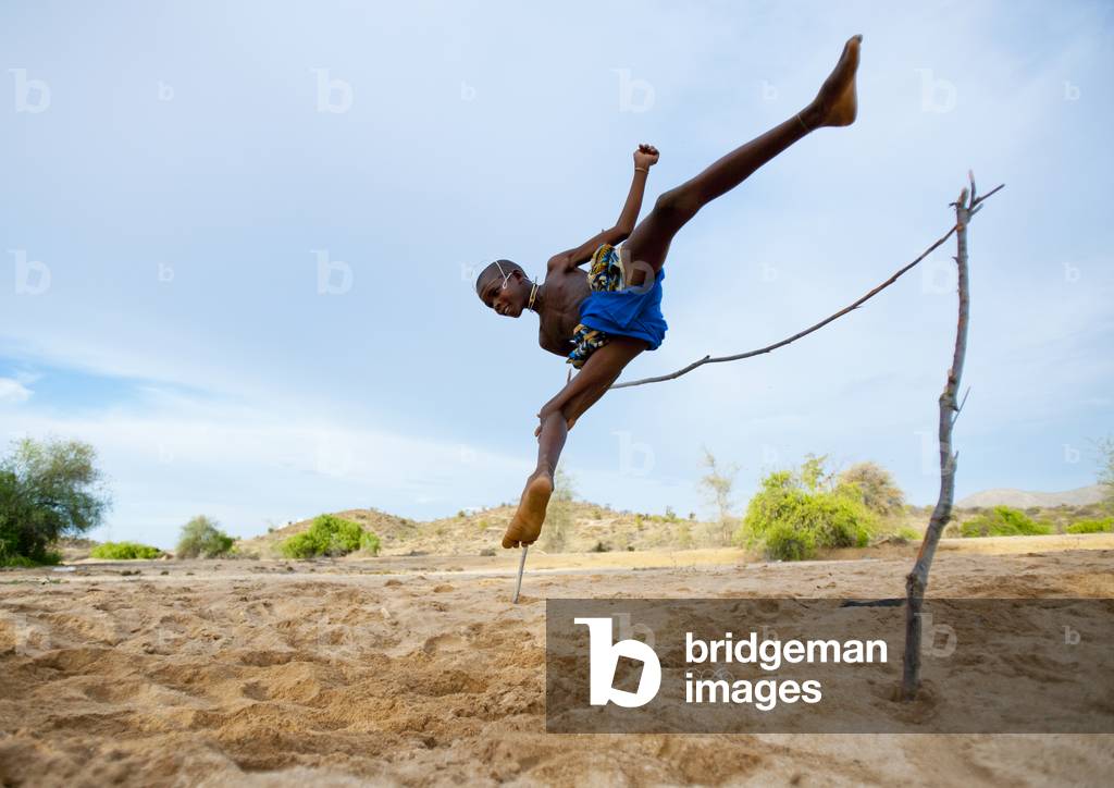 Mukubal Kid Doing High Jumping, Virie Area, Angola, Africa (photo)