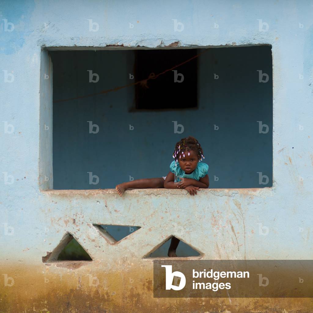 Young Girl Stepping Over the Edge, Huambo, Angola, Africa (photo)