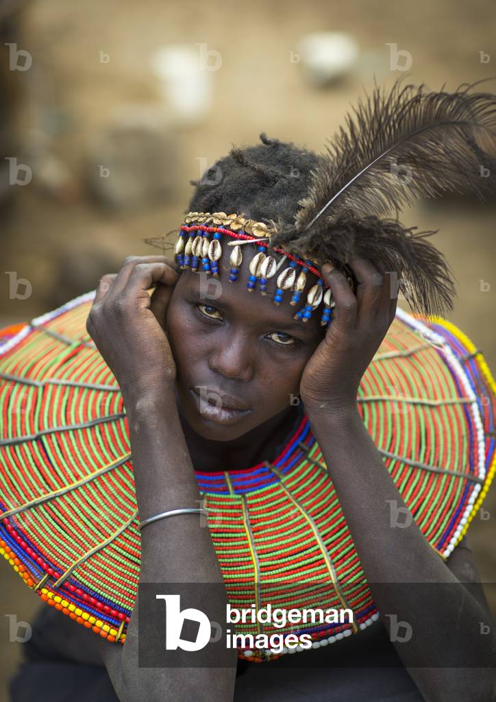 A pokot woman wears large necklaces made from the stems of sedge grass, Baringo county, Baringo, Kenya, Africa (photo)