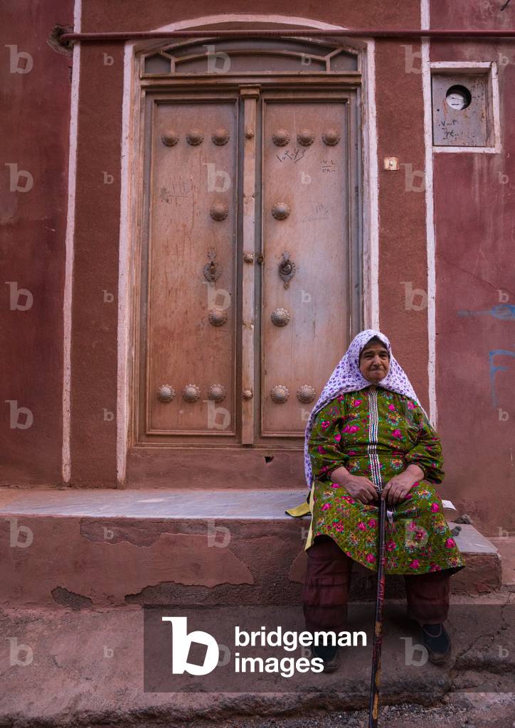 Portrait of an Iranian Woman wearing Traditional Floreal Chador in Zoroastrian Village, Isfahan Province, Abyaneh, Iran (photo)