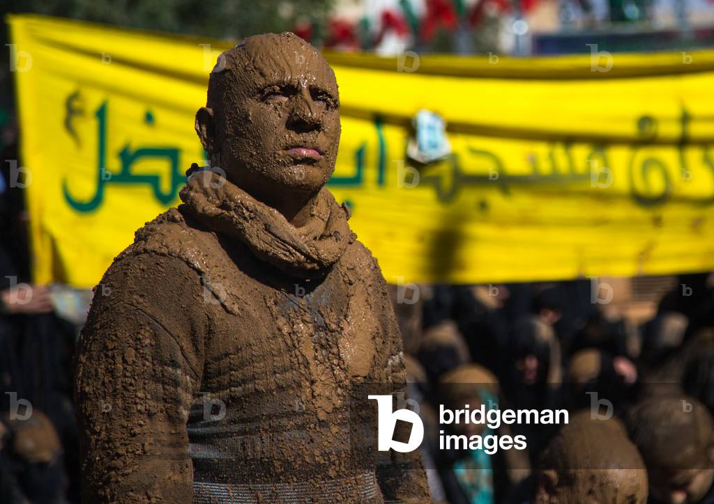 Iranian Shiite Muslim Man Covered in Mud during Ashura, Kurdistan Province, Bijar, Iran (photo)