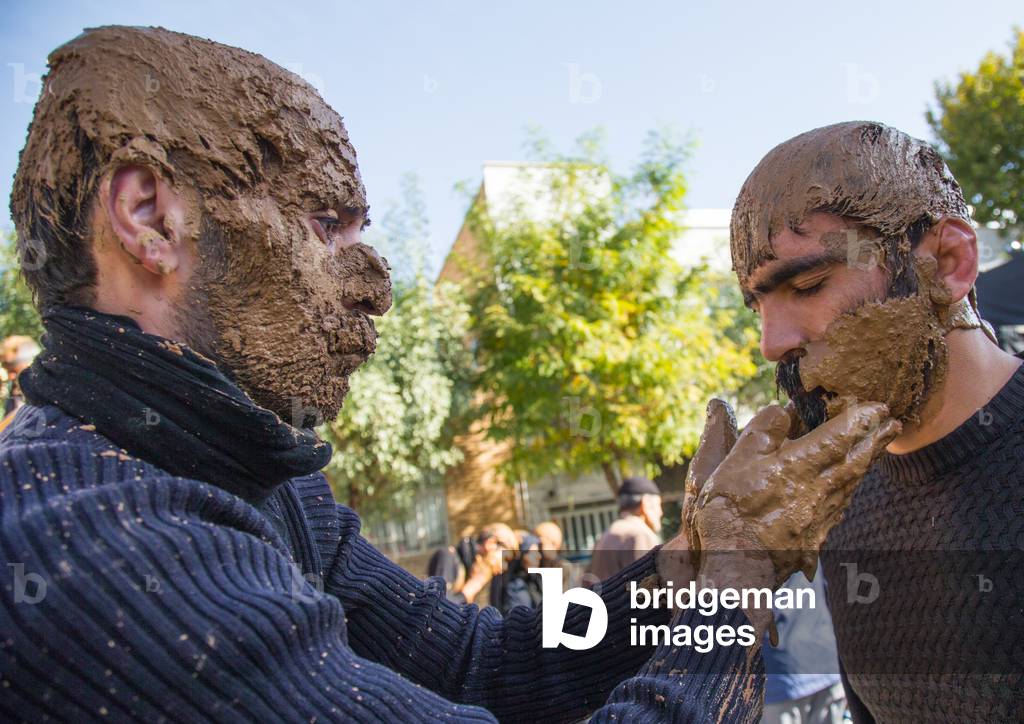 Iranian Shiite Muslim Men Covering with Mud during Ashura Day, Kurdistan Province, Bijar, Iran (photo)
